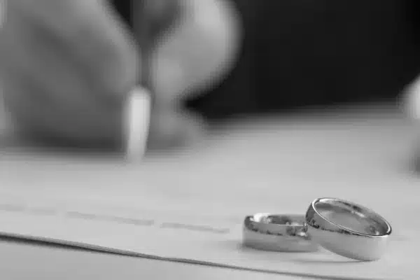 Hands of wife, husband signing decree of divorce,
