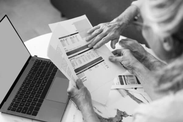 senior couple is reviewing utility bills